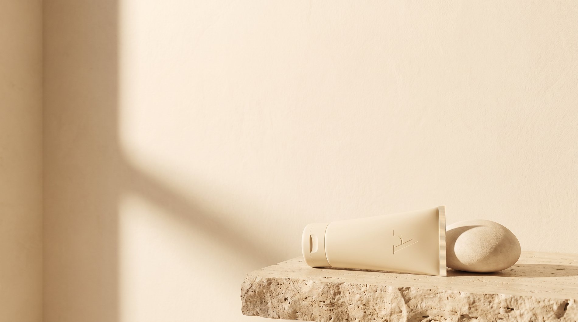 The White Theory, cream product on travertine in soft light